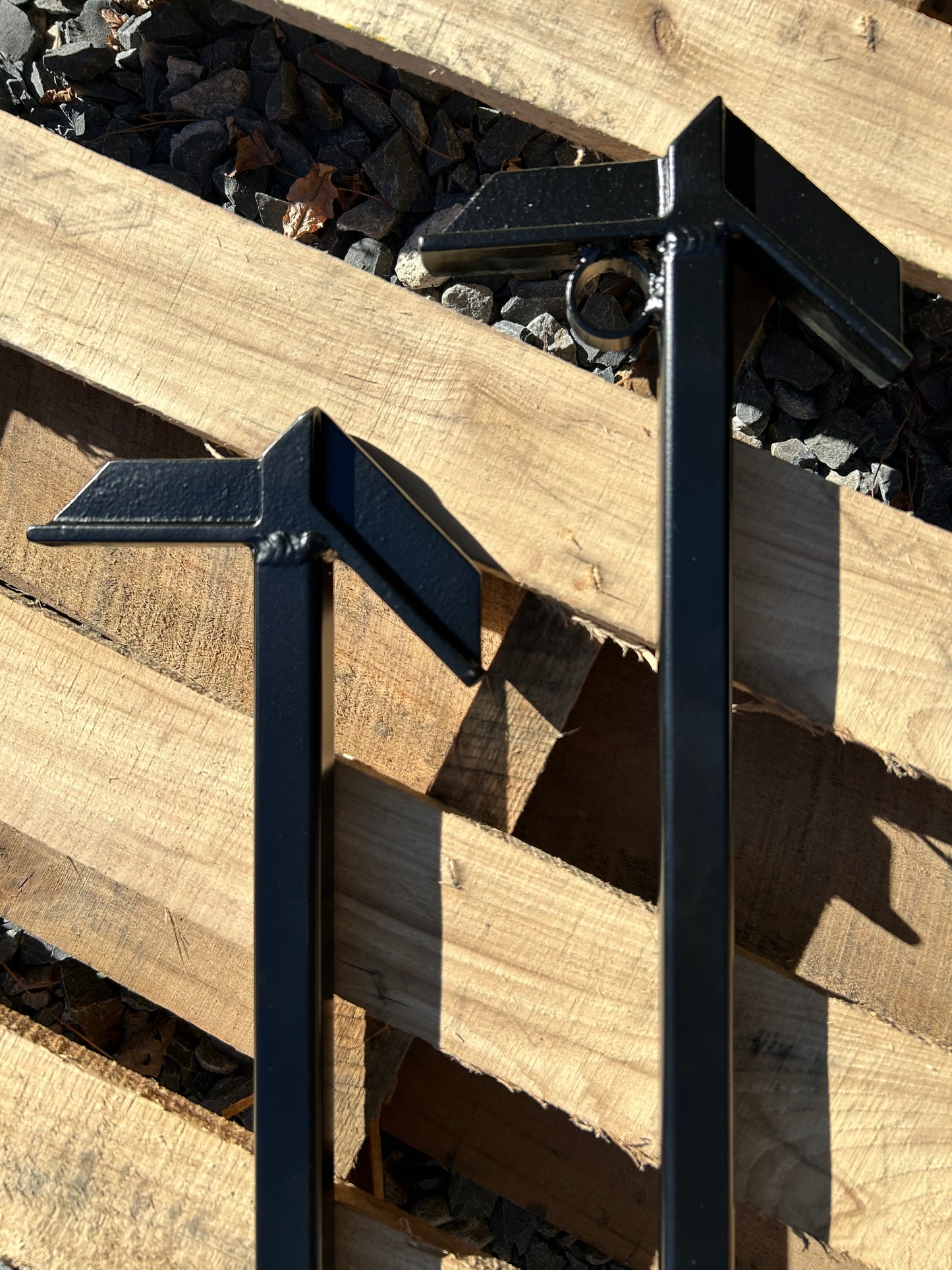 Metal fire hooks laying on wood pallets