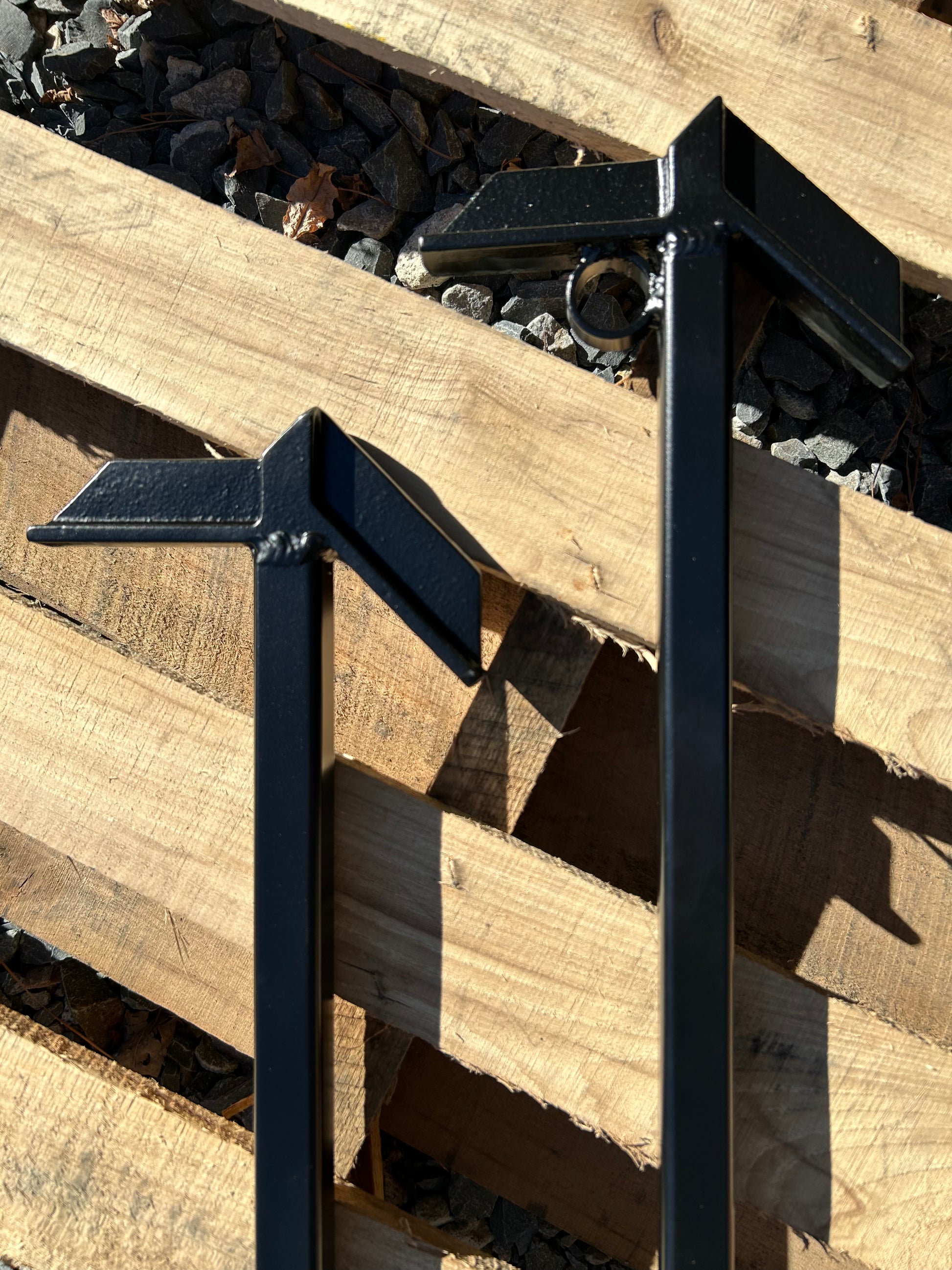 Metal fire hooks laying on wood pallets